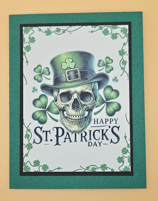 St. Patrick's Day card with a skull wearing a leprechaun hat and shamrocks.