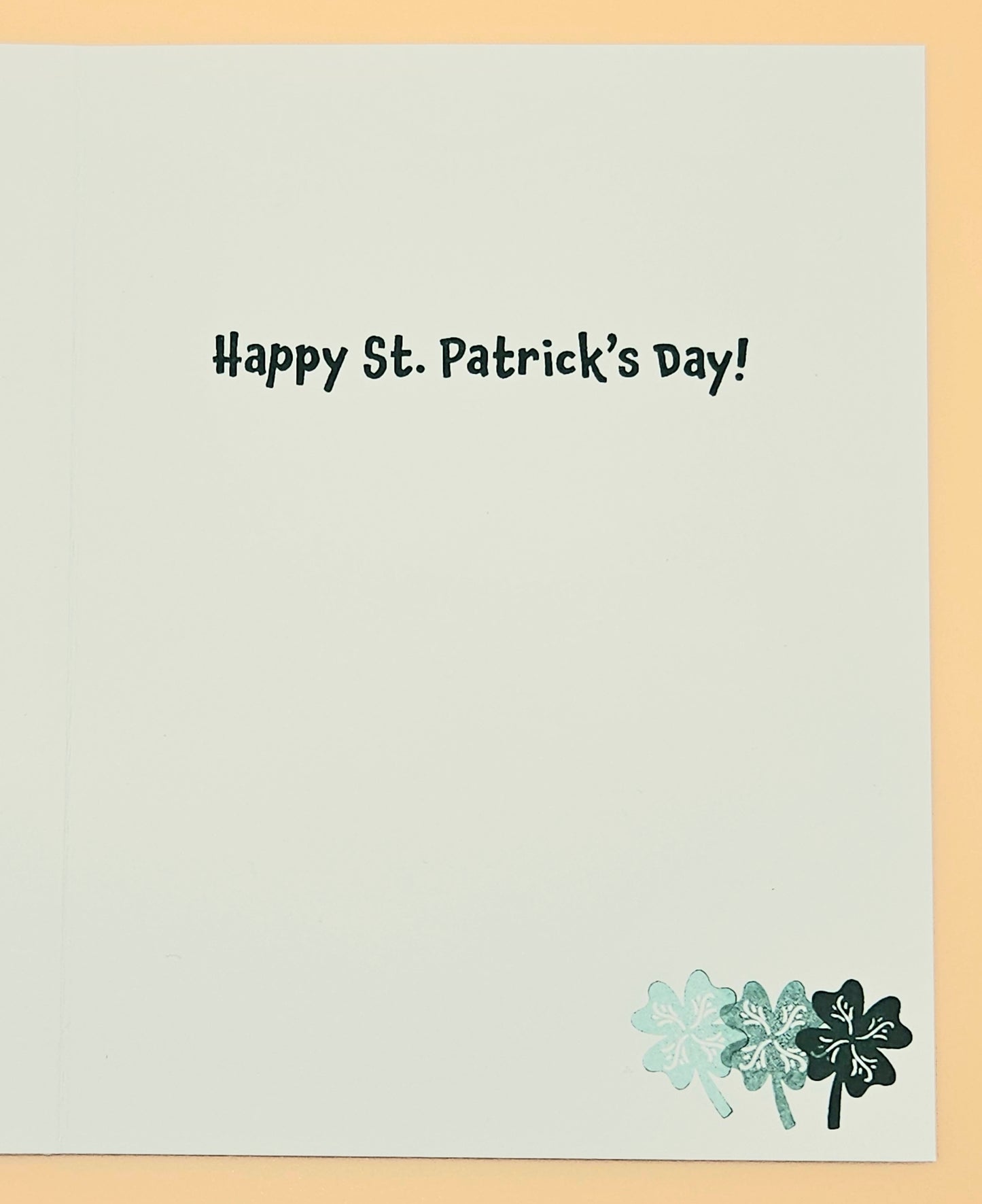 St. Patrick's Day card with text and shamrock design on a light gray background