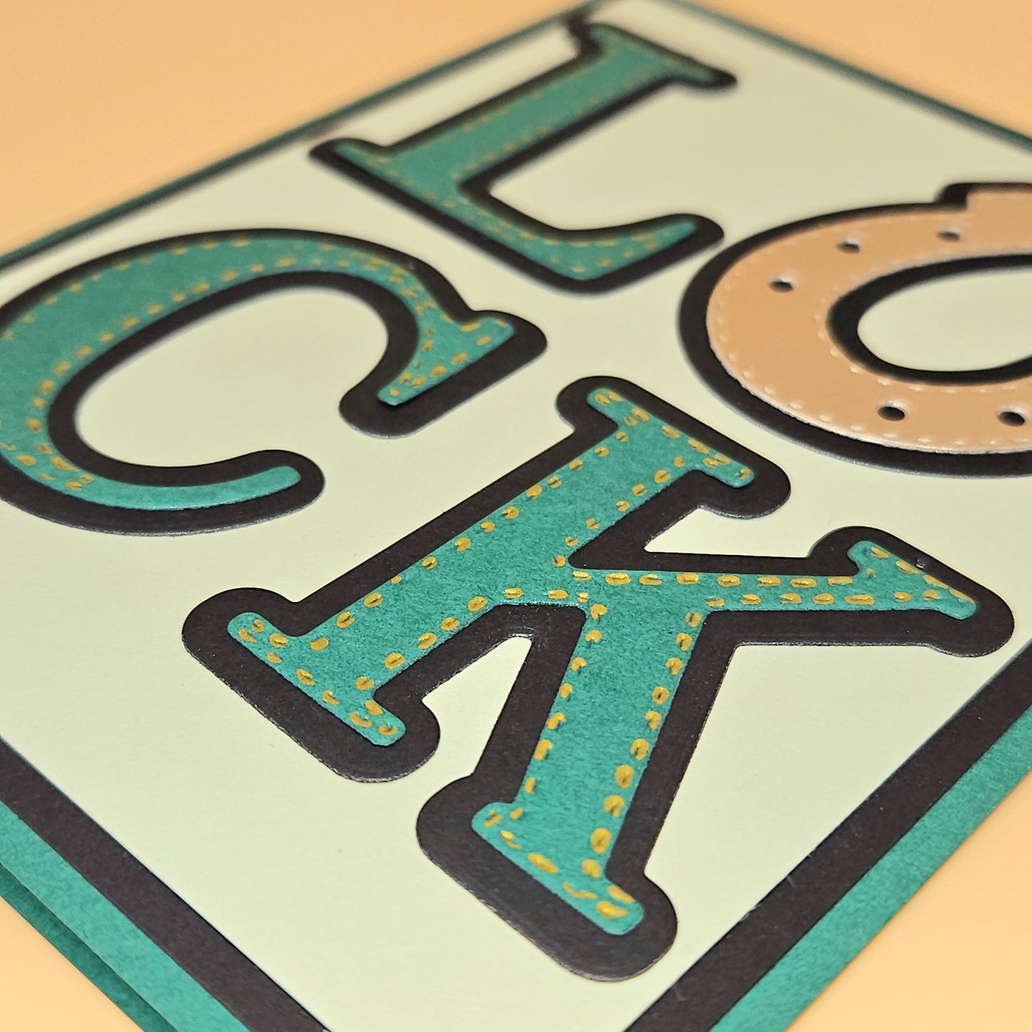 Close-up of a decorative sign with 'LOCK' text on a light background