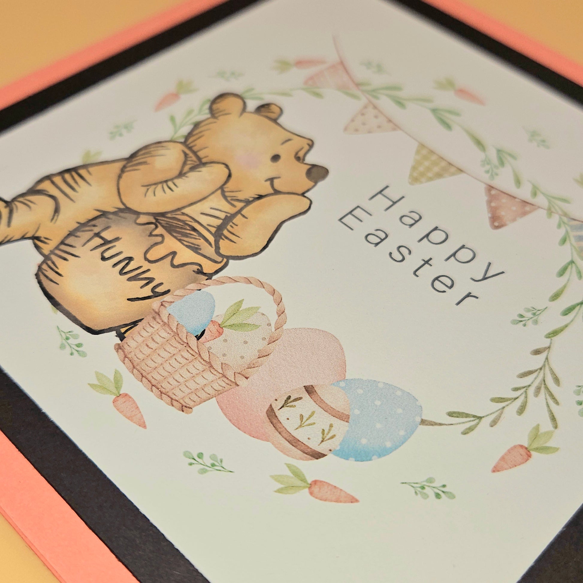 Easter card with a bear holding a basket labeled 'Hunny' and 'Happy Easter' text.