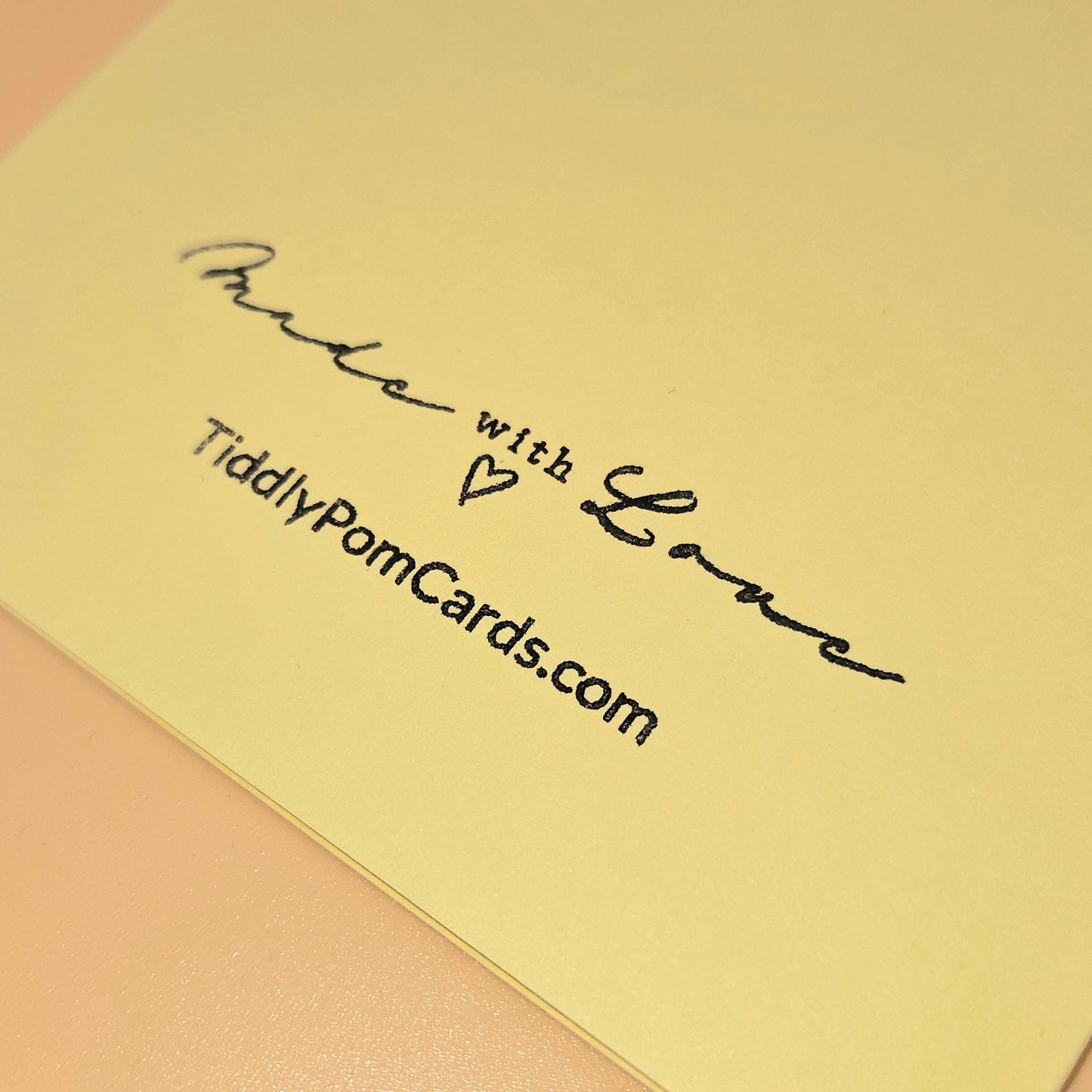 Yellow card with 'Made with Love' and 'TiddlyPomCards.com' text on a pink background