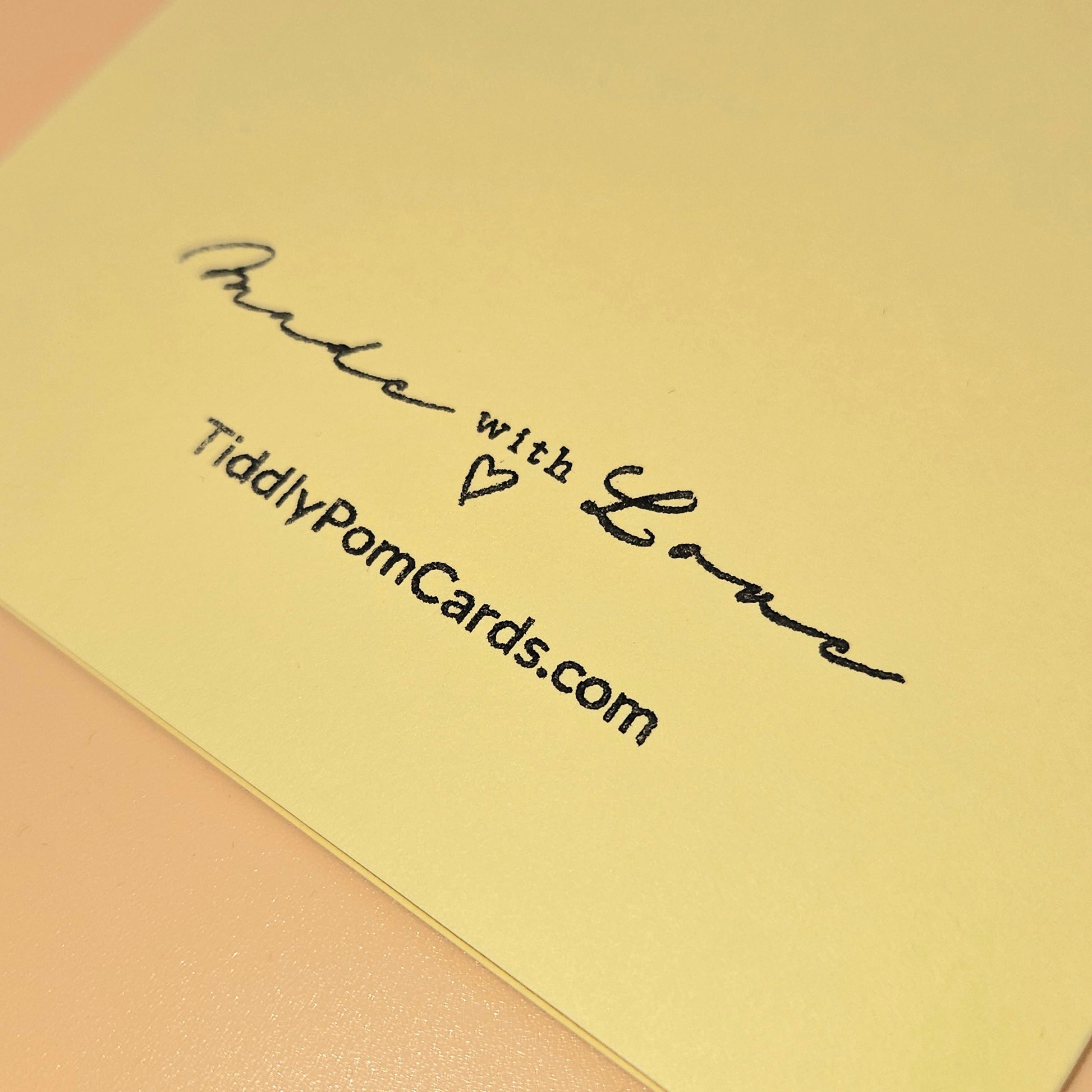 Yellow card with 'Made with Love' and 'TiddlyPomCards.com' text on a pink background