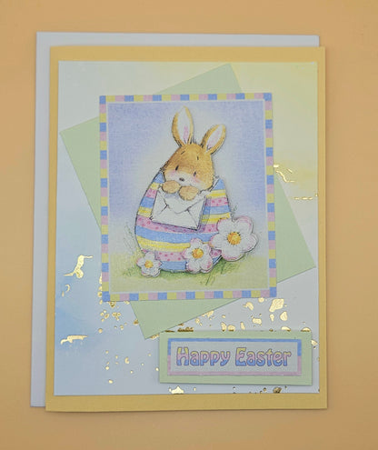 Easter card with a bunny holding a flower on a beige background