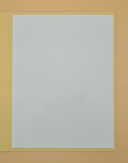 White sheet of paper with a yellow border on a beige background