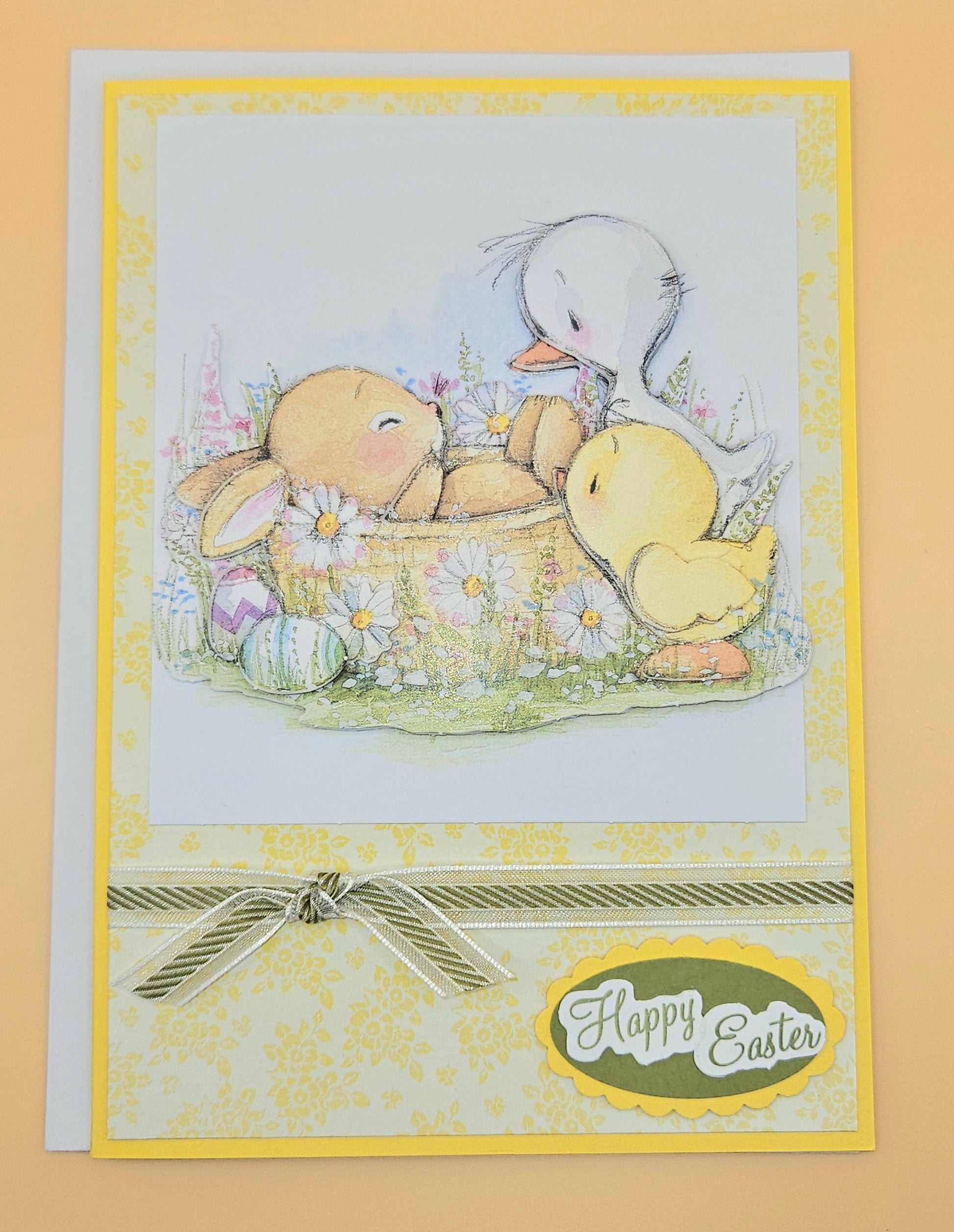 Easter card with teddy bear, ducklings, and basket of eggs on a yellow background