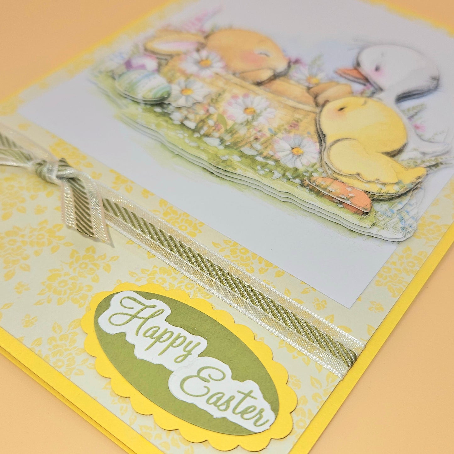 Easter card with rubber duckies and 'Happy Easter' text on a yellow background