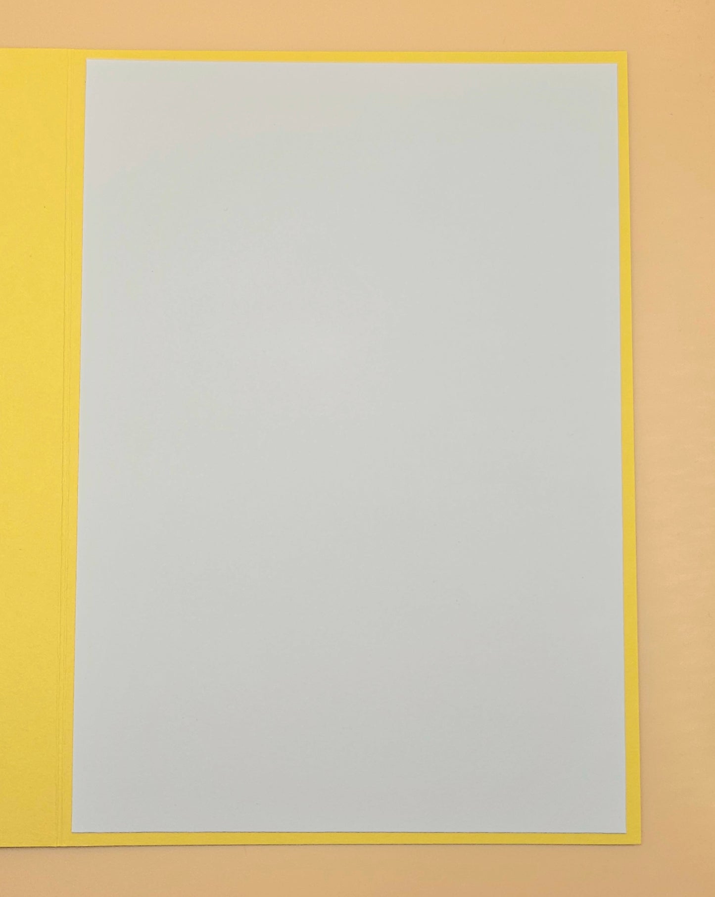 Rectangular frame with a yellow border and a gray center on a beige background