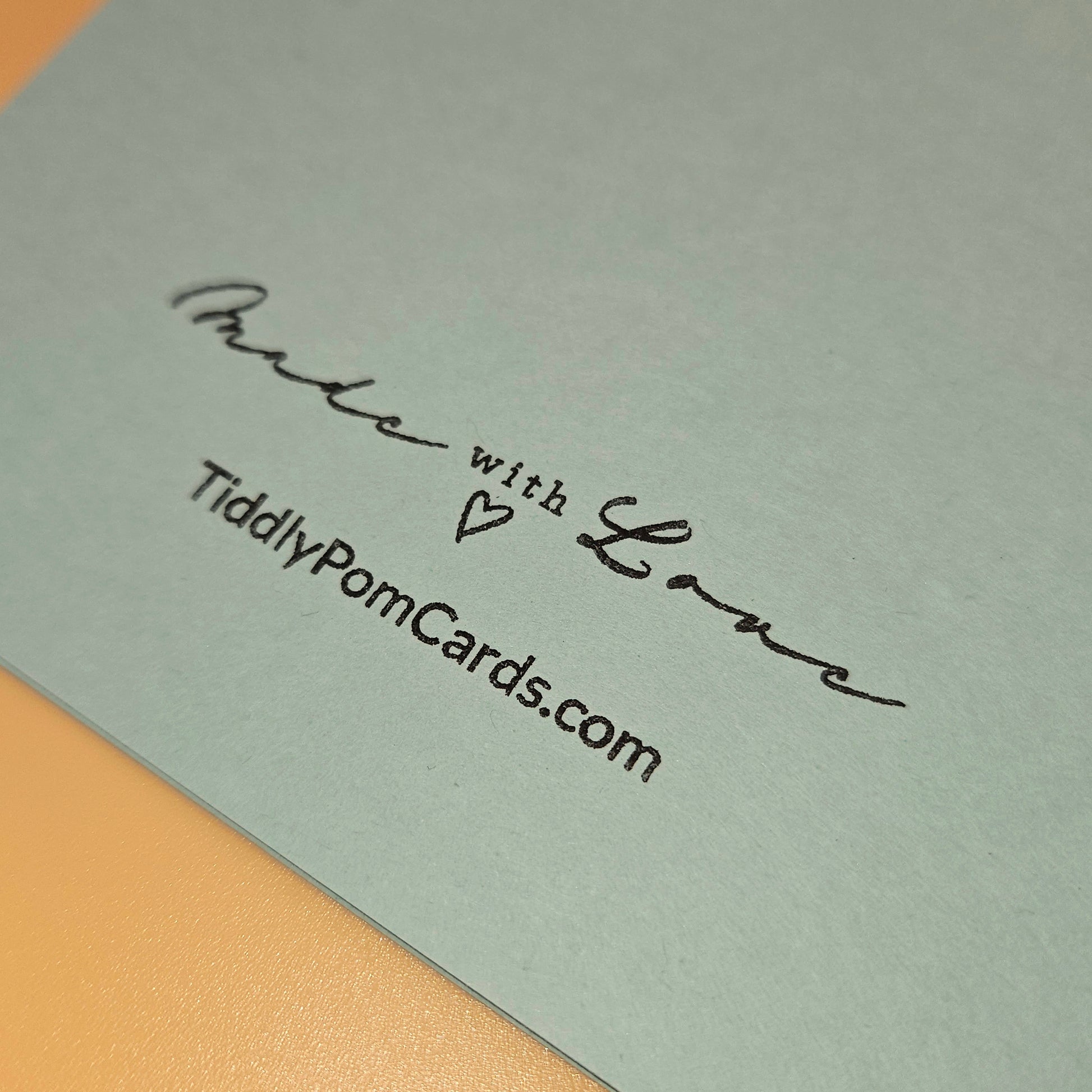 Card with 'Made with Love' and TiddlyPomCards.com text on a light gray background