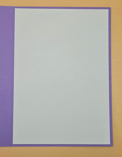 White card with purple border on a brown background