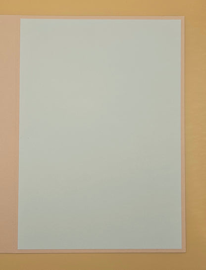 White sheet of paper on a beige background