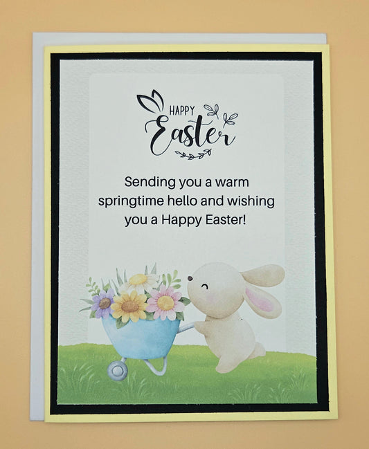 Easter card with a bunny and flowers on a beige background
