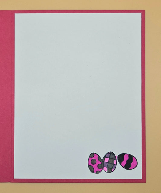 Card with plaid patterned eggs on a plain background