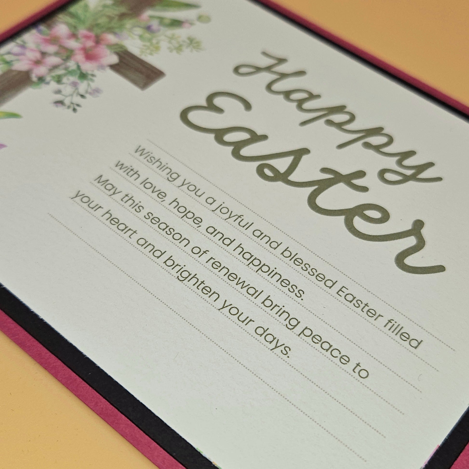 Easter card with floral design and text on a pink border