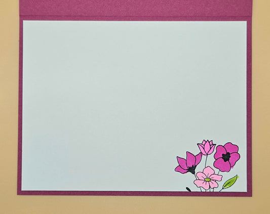 Floral design on a white card with a purple border, placed on a beige background.