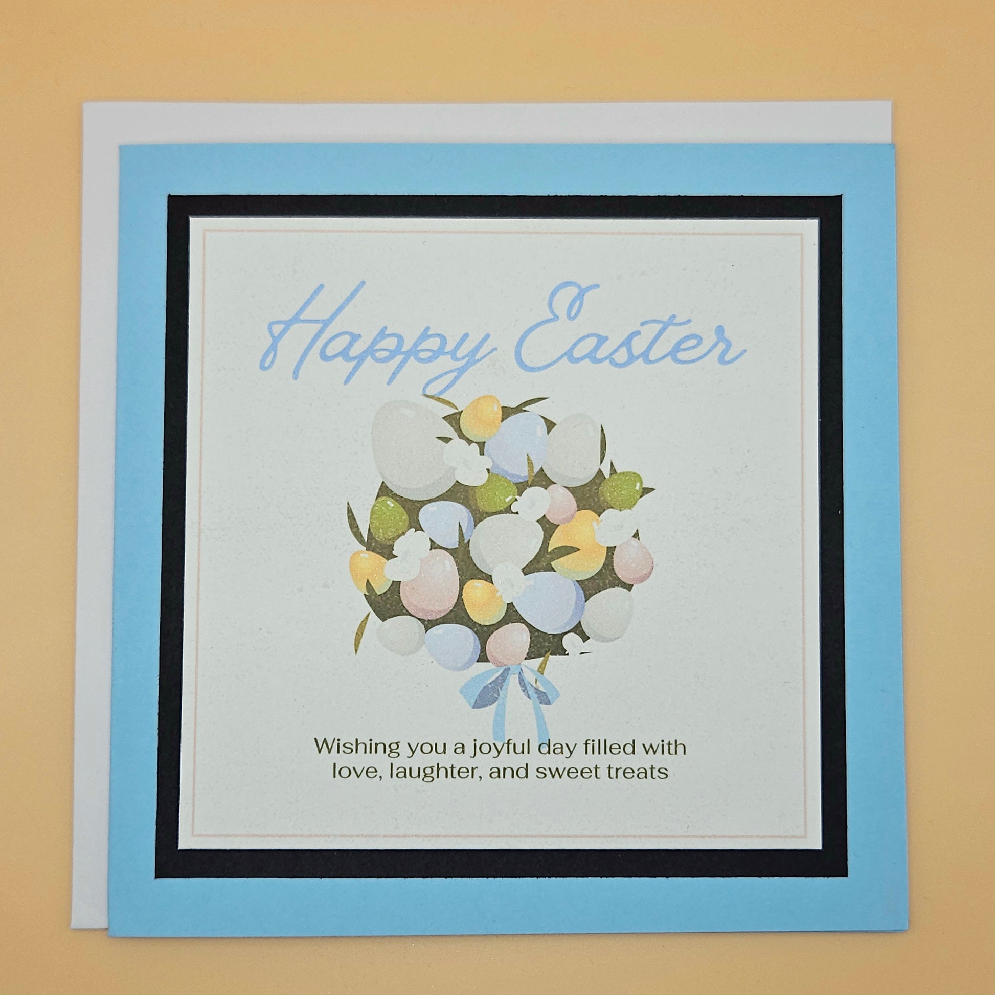Easter card with colorful eggs and text on a beige background