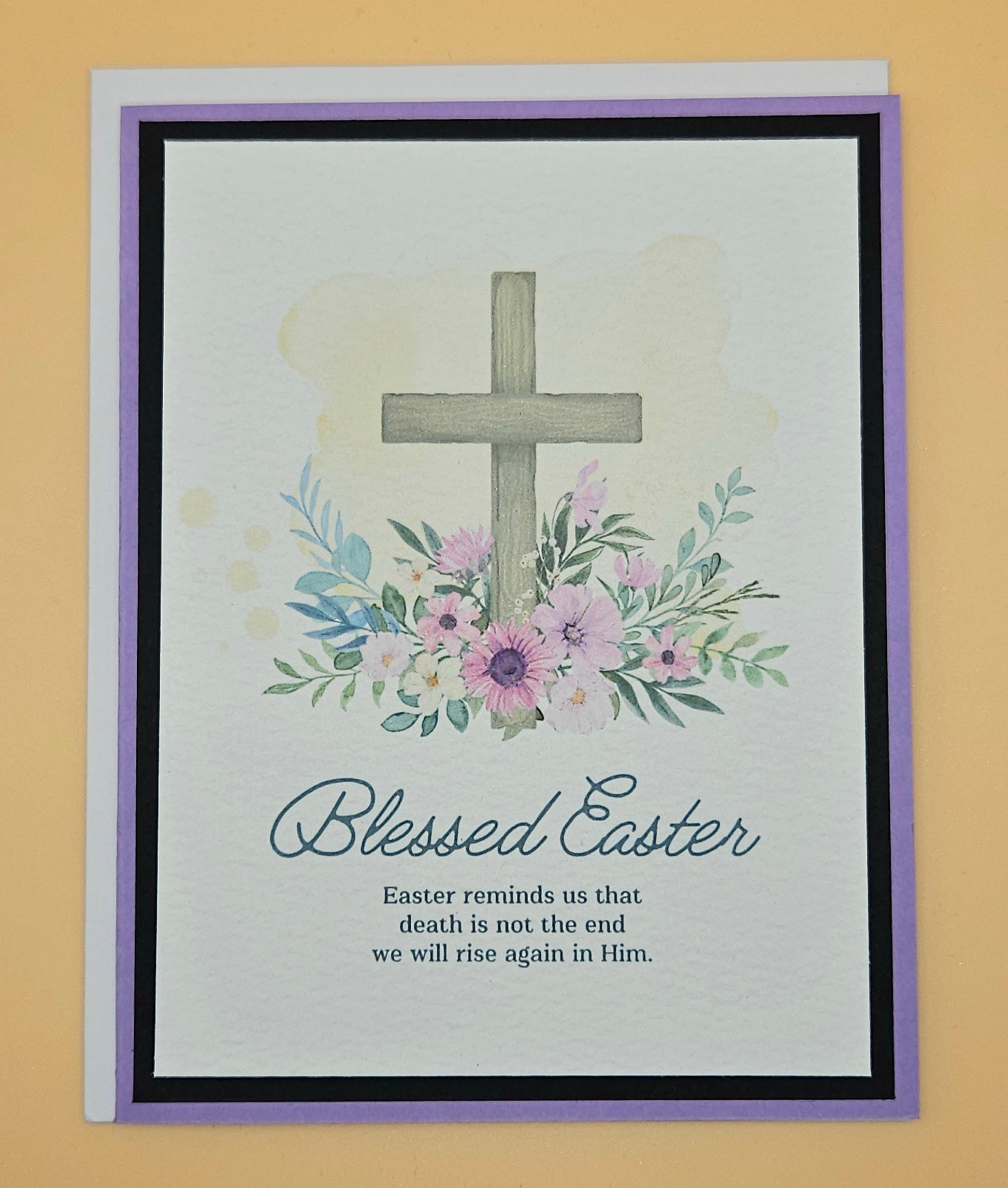 Easter card with cross and flowers on a beige background