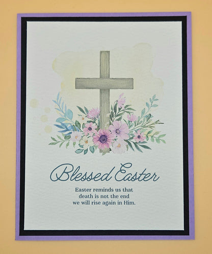 Framed artwork with a cross, flowers, and 'Blessed Easter' text on a light background.