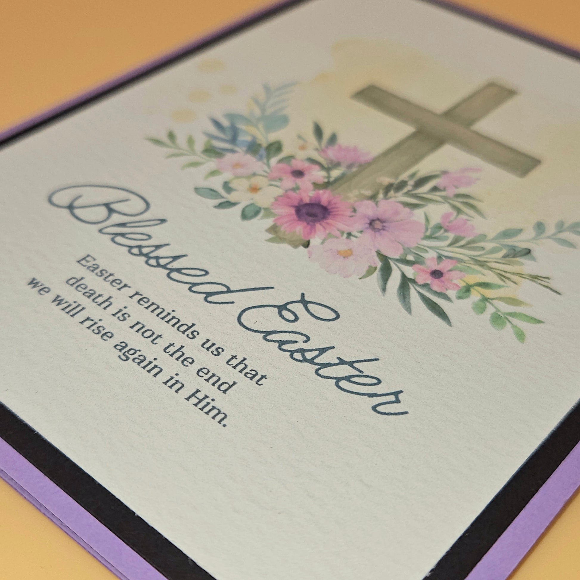 Easter card with cross and flowers on a light background
