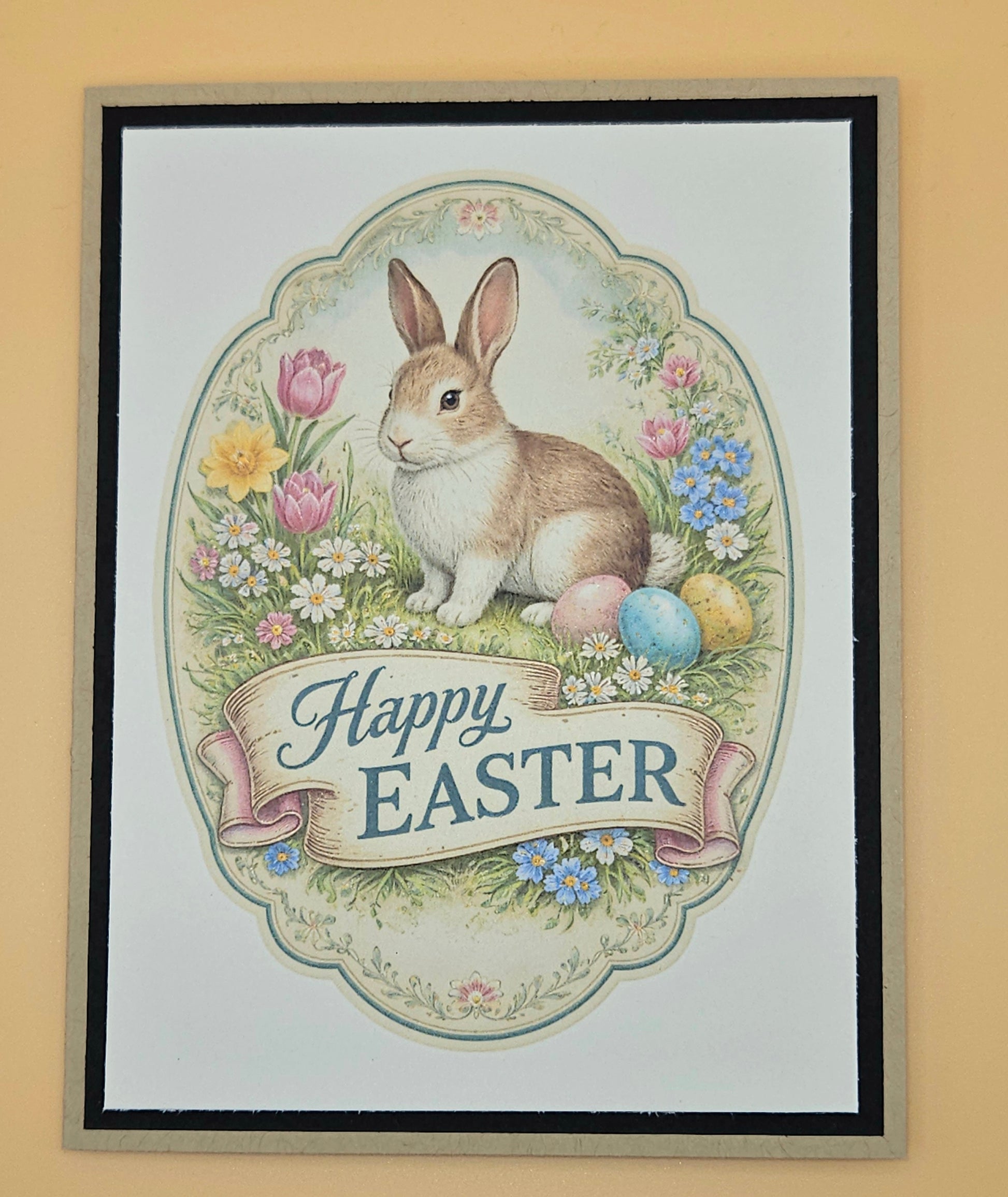 Framed Easter card with a rabbit and eggs on a beige background