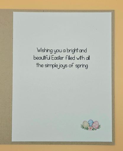 Easter card with text and Easter eggs on a beige background