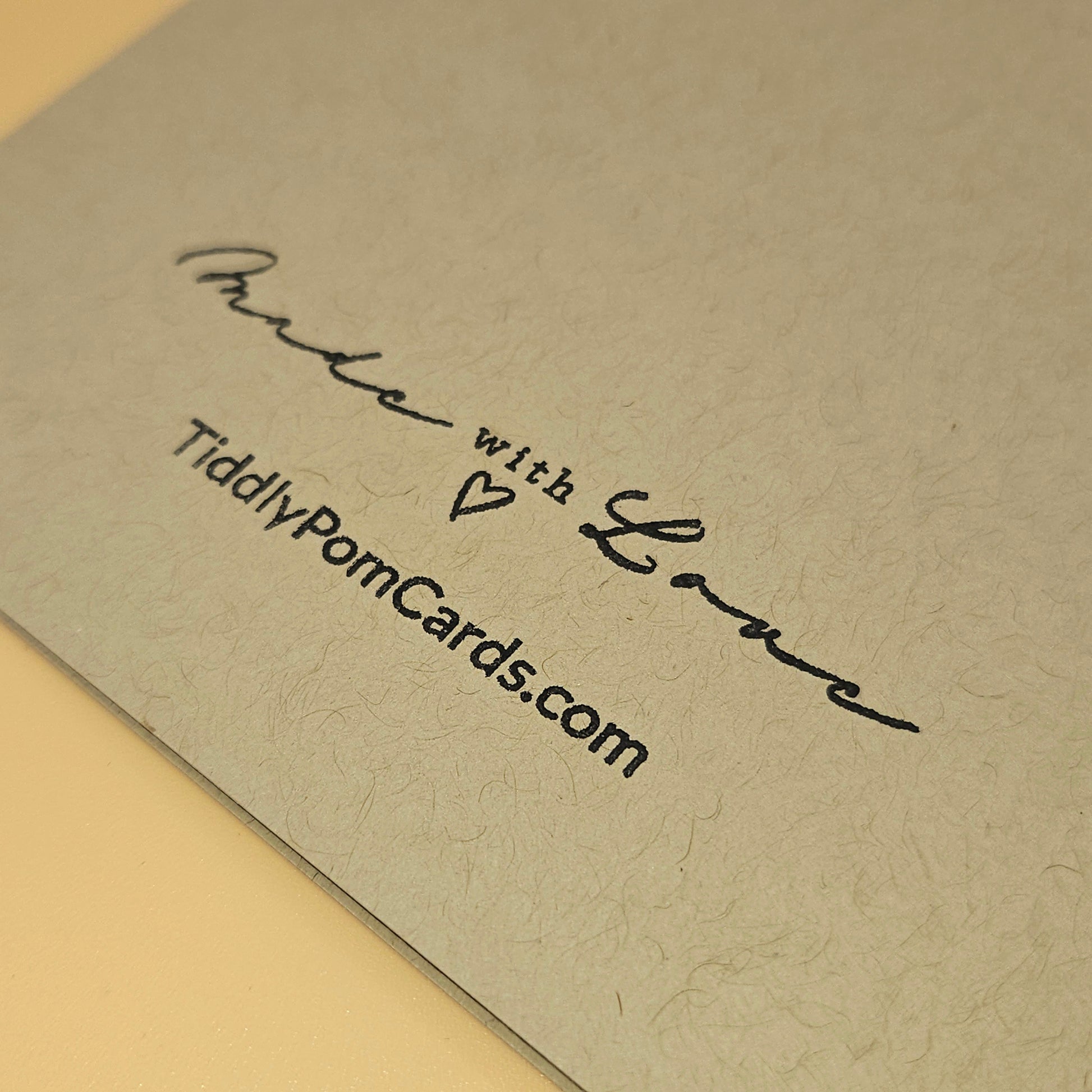 Text 'Made with Love TiddlyPomCards.com' on a textured beige card