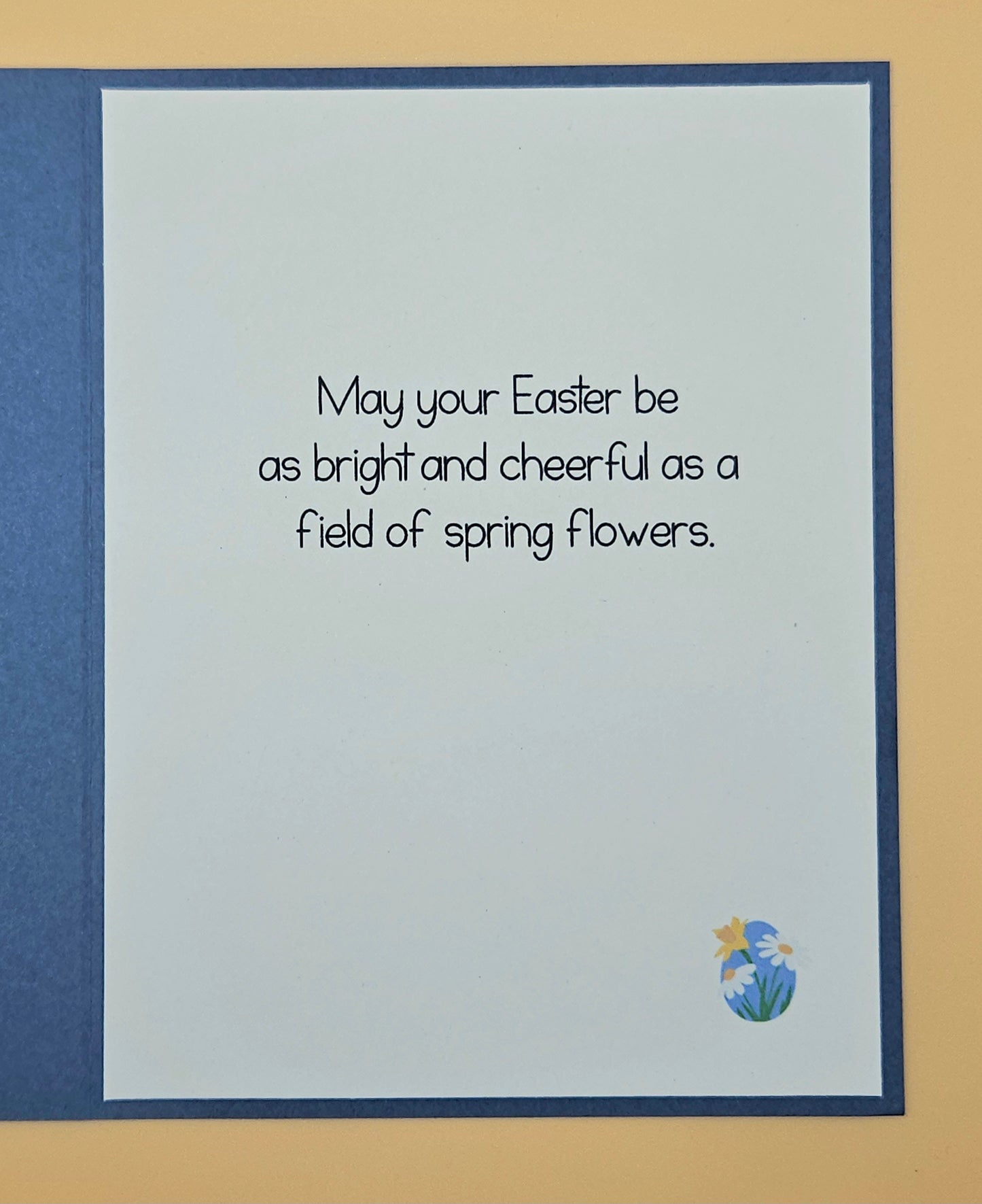 Easter card with text and floral design on a blue border
