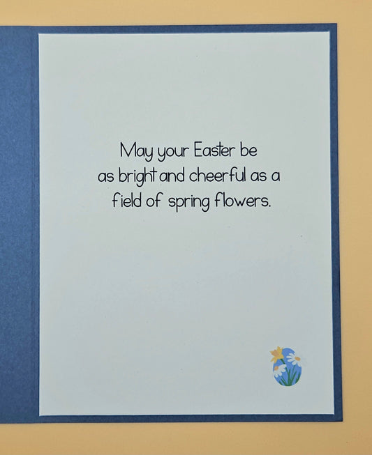 Easter card with text and floral design on a blue border