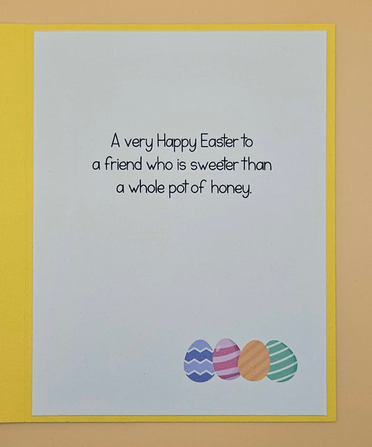 Easter card with colorful eggs and a humorous message on a yellow border.