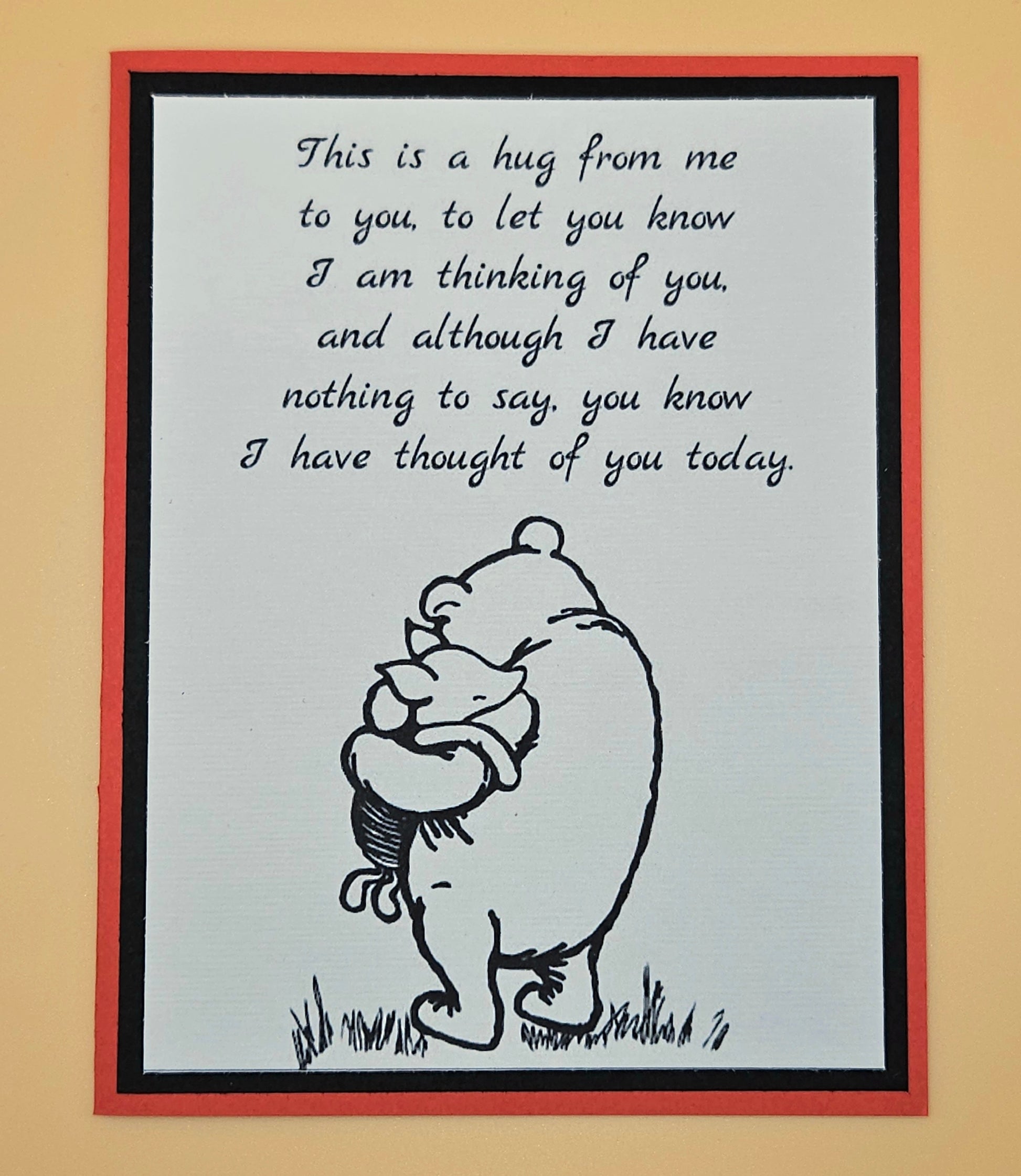 Card with a bear hugging a heart and text on a beige background
