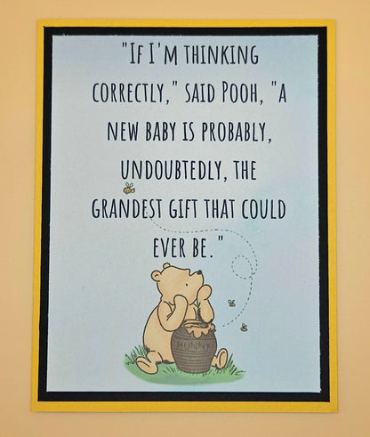 Framed print with Pooh bear and a quote on a beige wall