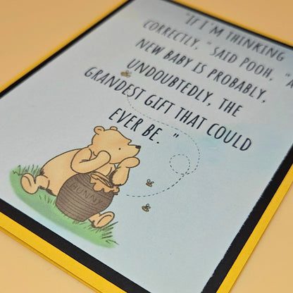 Greeting card with Winnie the Pooh illustration and text on a yellow border