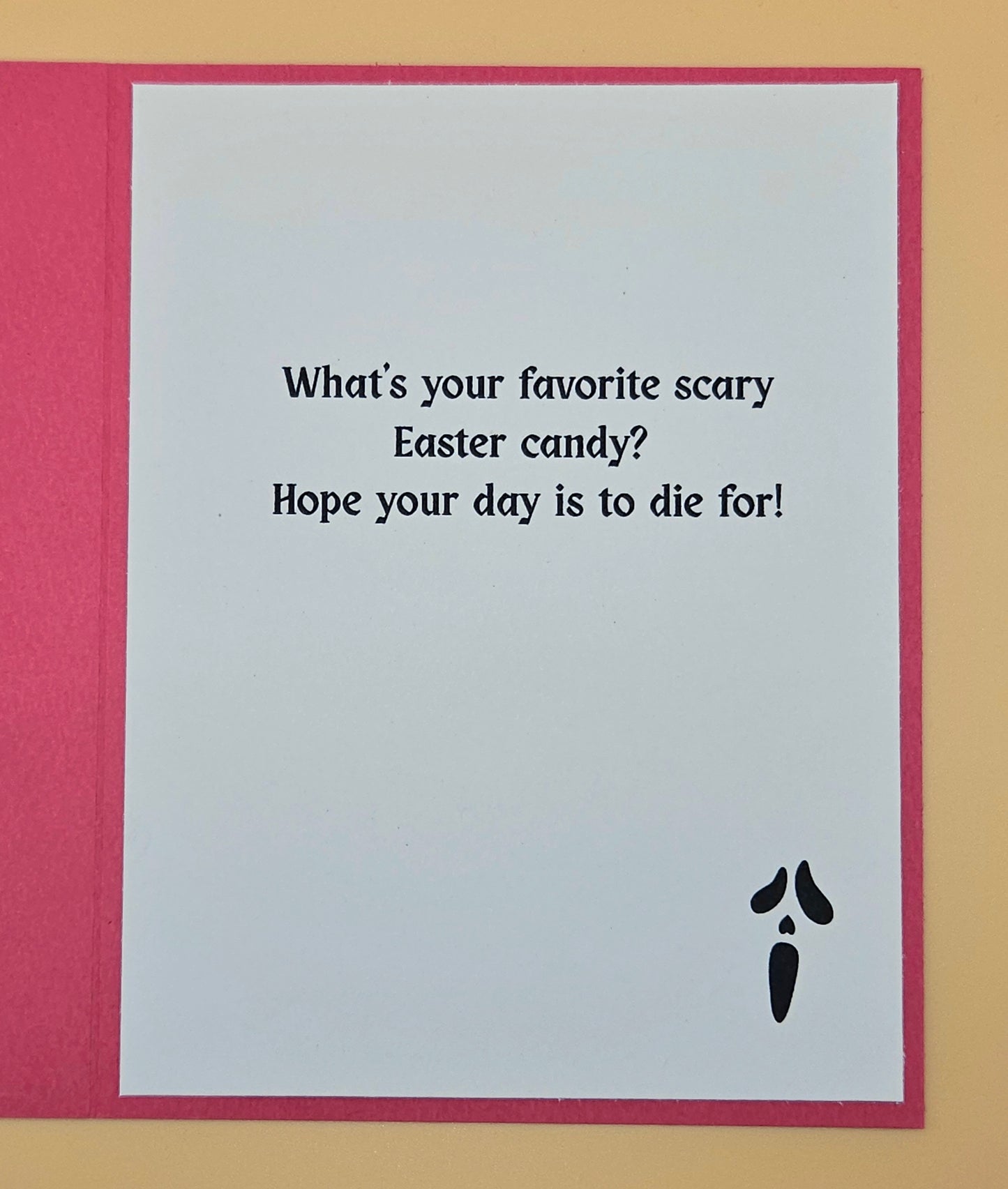 Card with humorous Easter message and black carrot illustration on a red border.