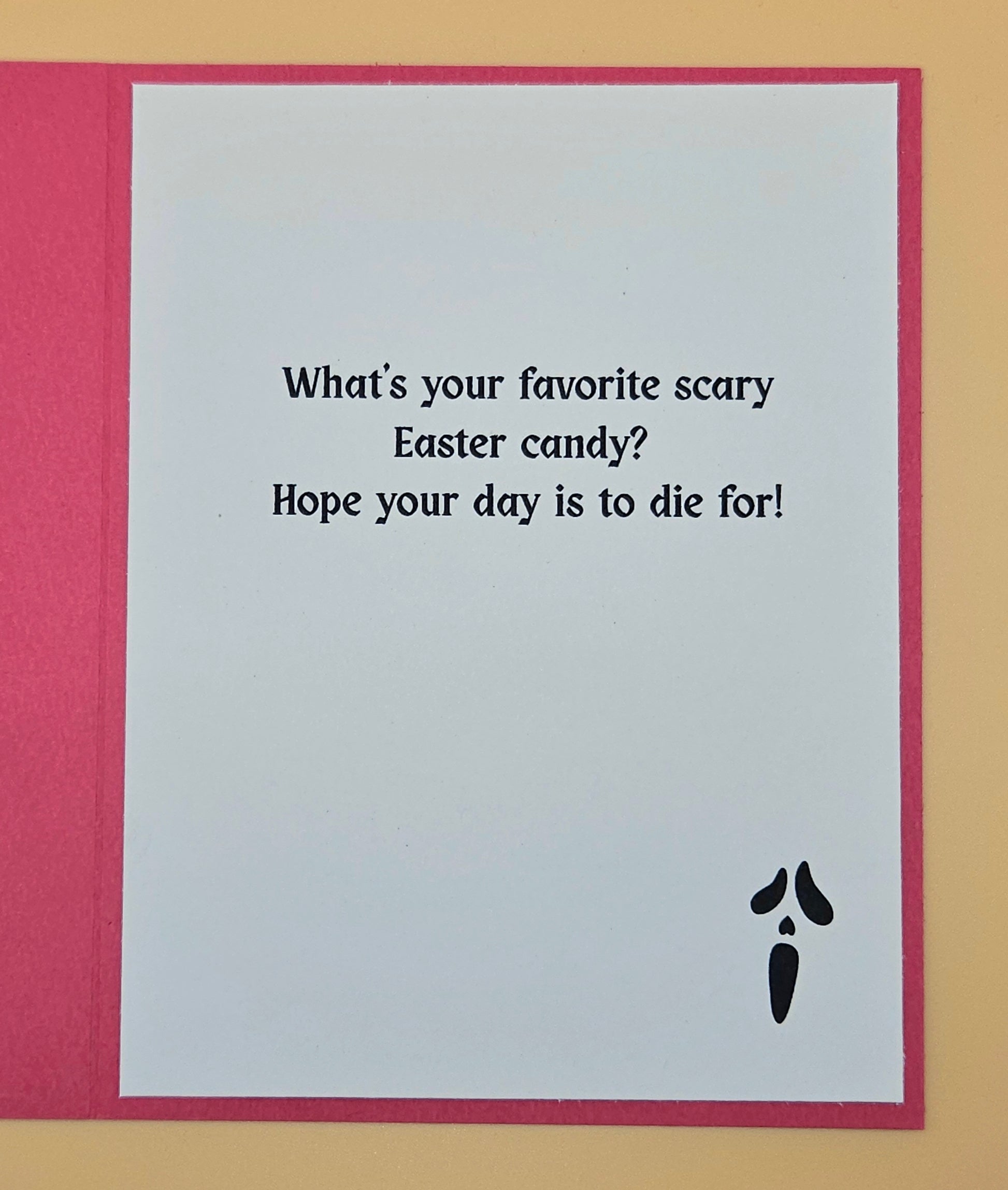 Card with humorous Easter message and black carrot illustration on a red border.
