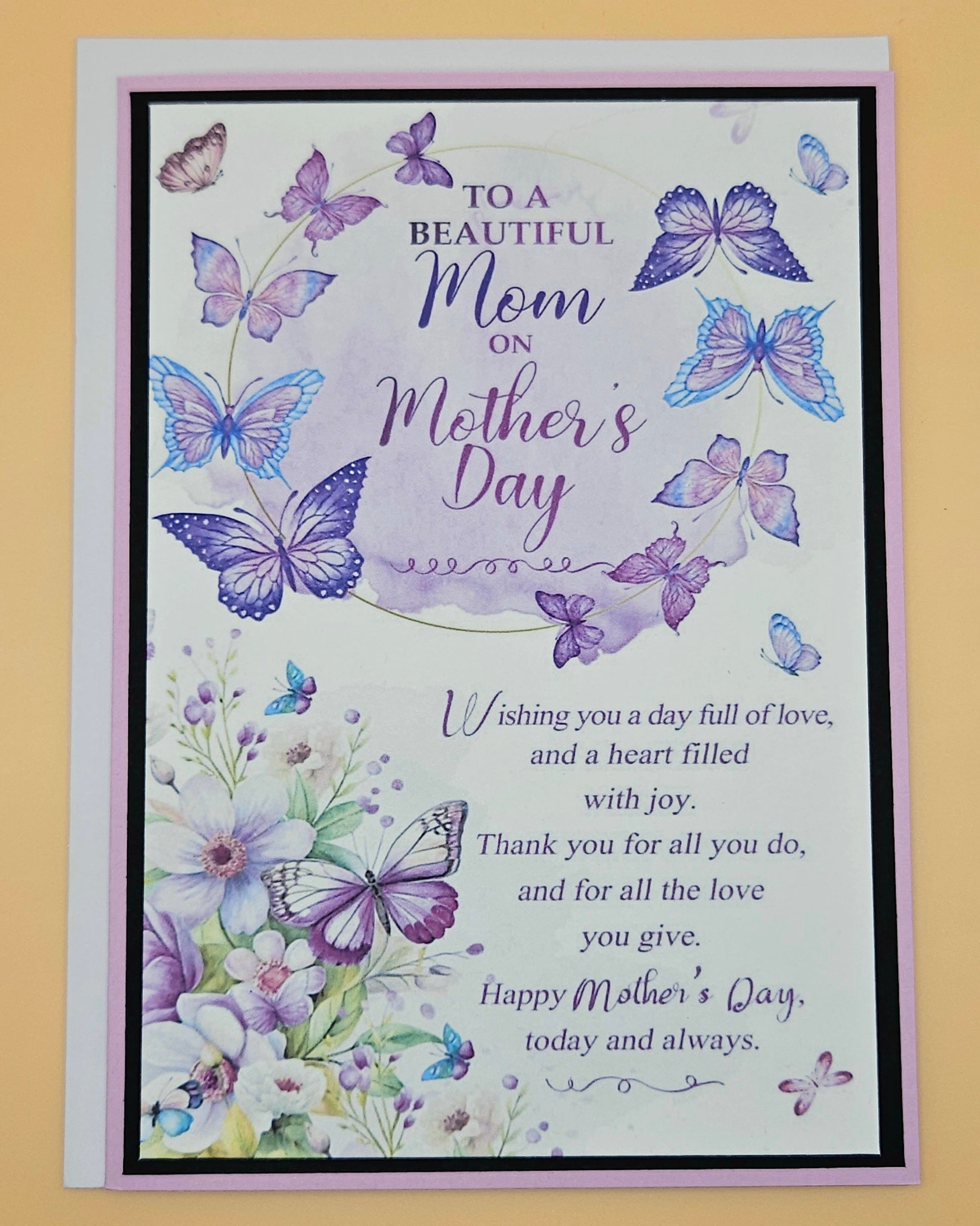 Mother's Day card with butterflies and flowers on a beige background