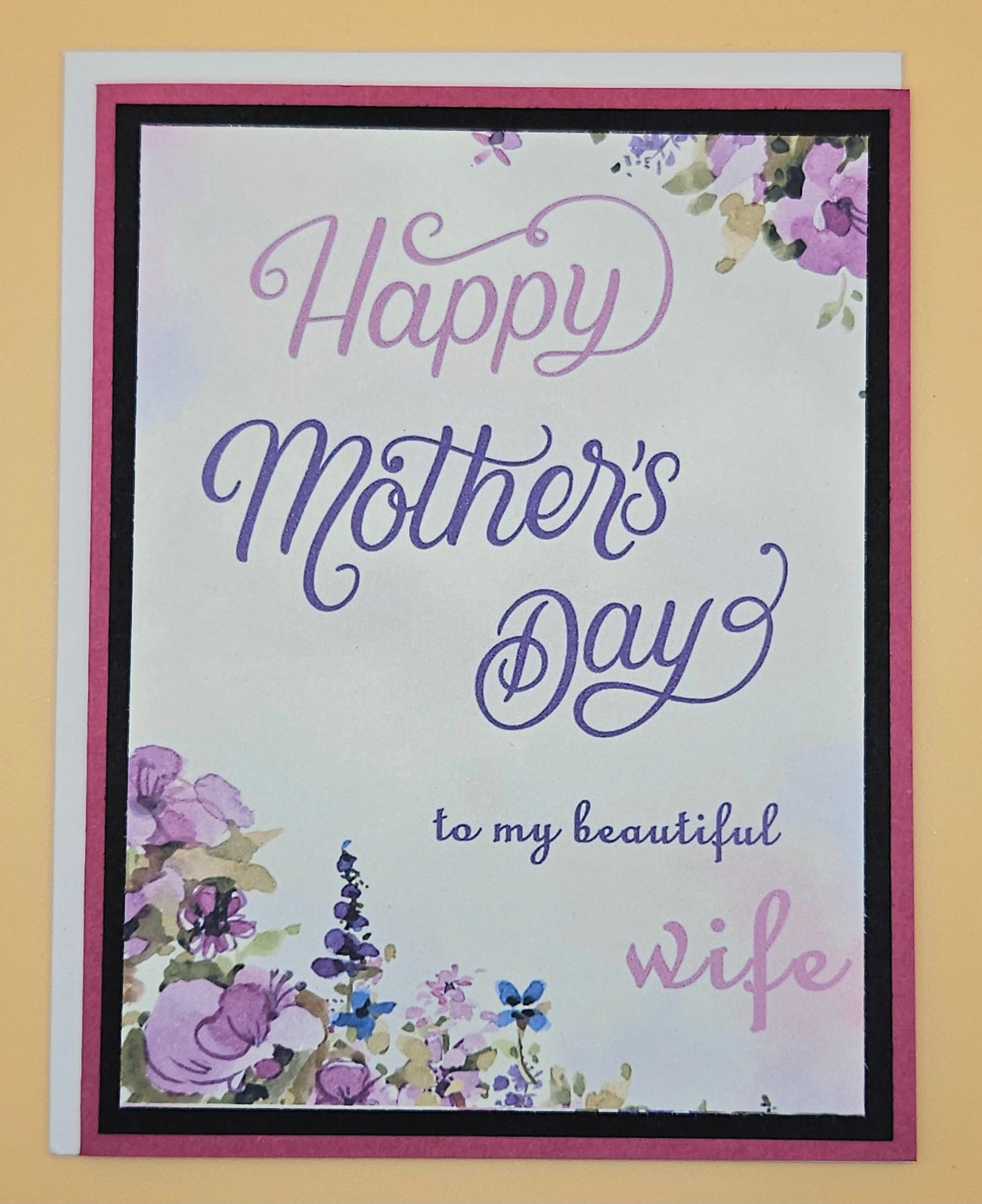 Greeting card with 'Happy Mother's Day to my beautiful wife' text and floral designs on a yellow background