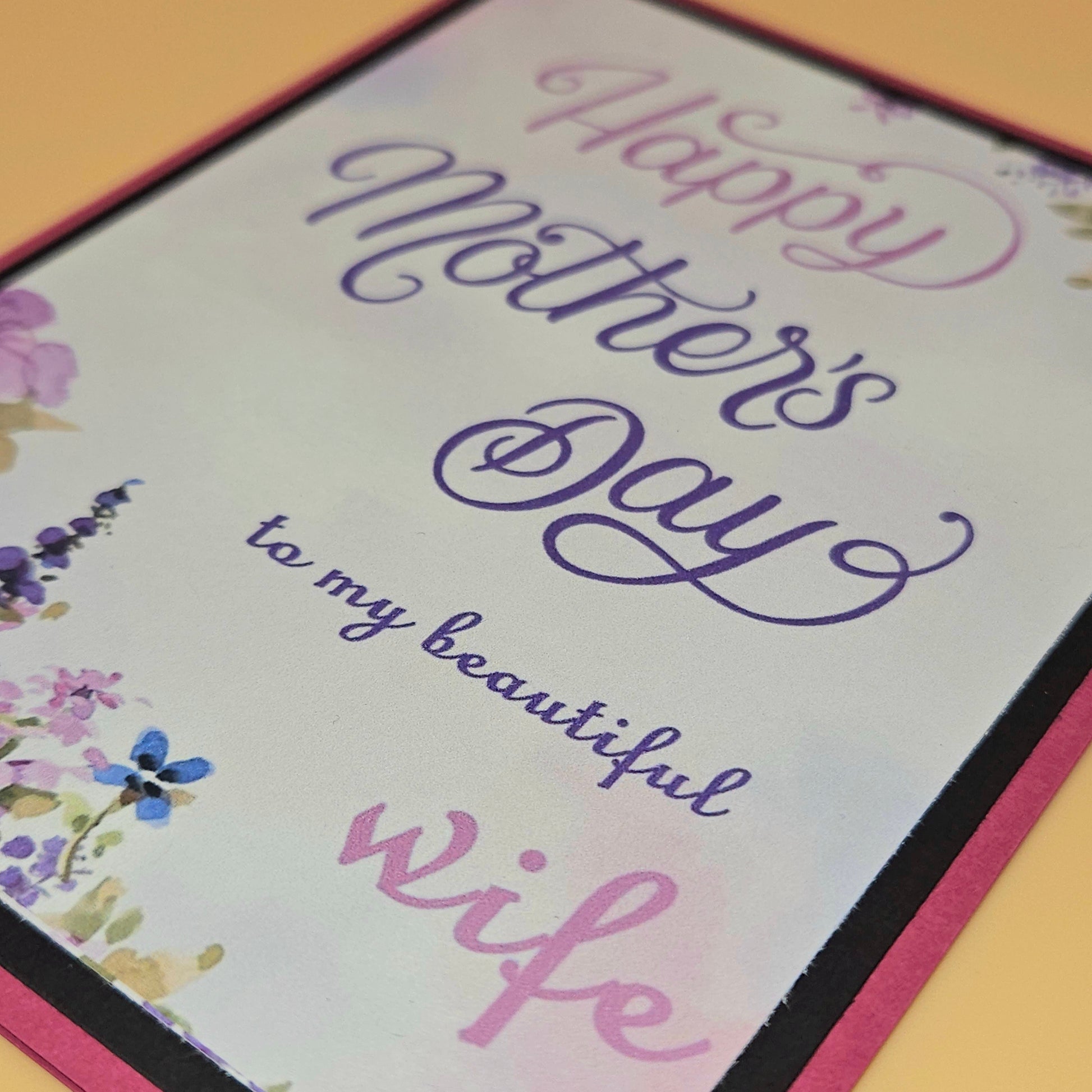 Greeting card with 'Happy Mother's Day to my beautiful wife' text on a floral background.