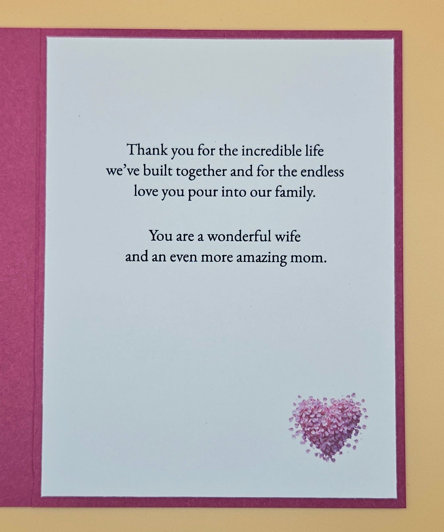 Greeting card with heartfelt message and heart design on a beige background