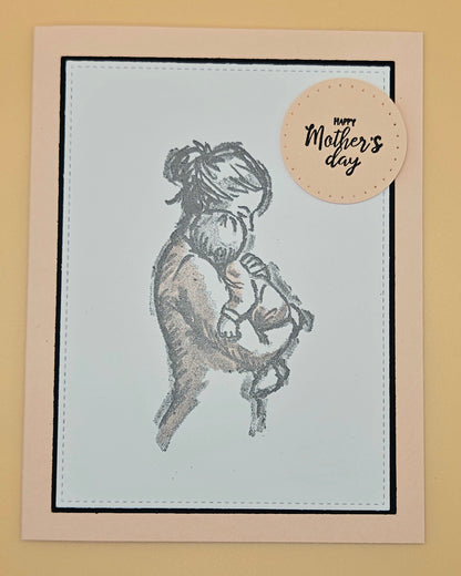 Greeting card with illustration of a woman holding a baby and 'Happy Mother's Day' tag on beige background