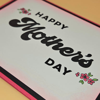 Mother's Day card with decorative flowers on a pink border