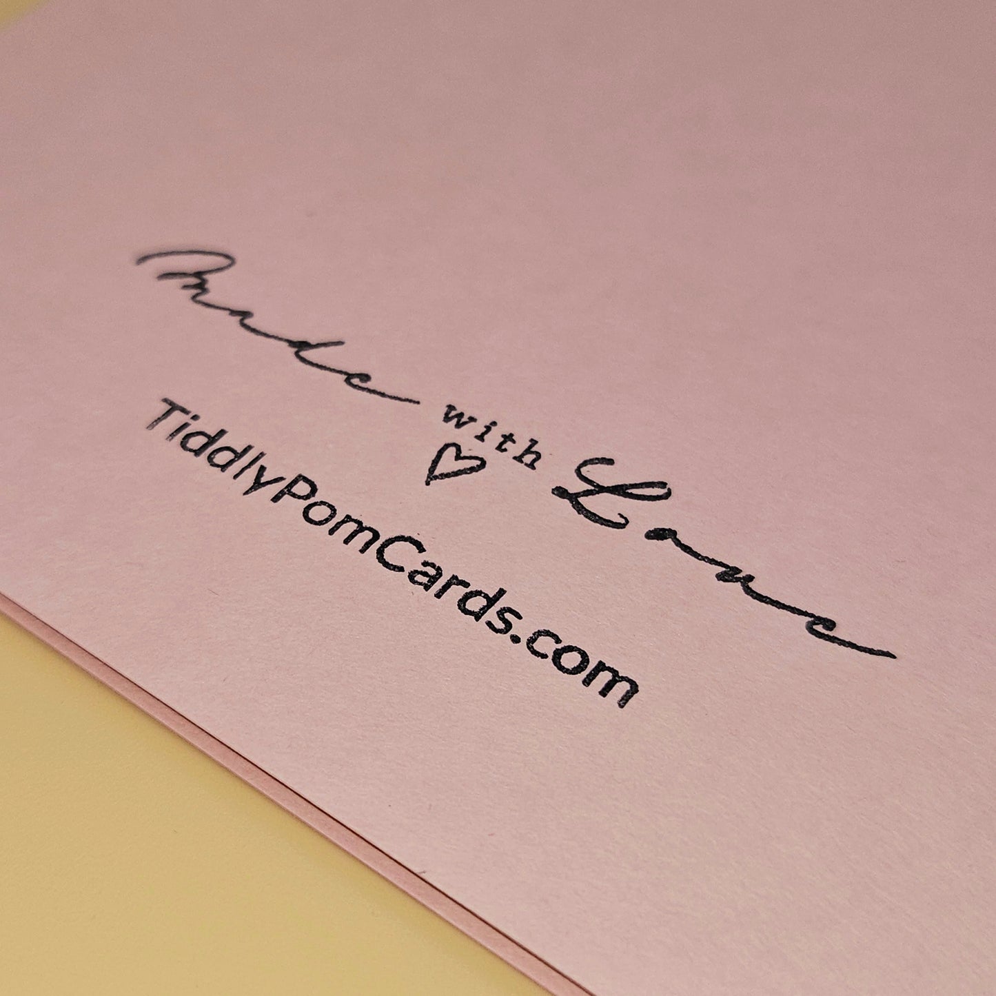 Pink card with 'Made with Love' text and TiddlyPomCards.com on a pink background
