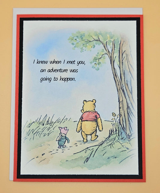 Card with Winnie the Pooh and Piglet walking together and a quote on a beige background