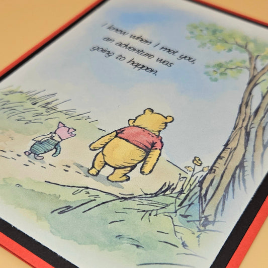 Cartoon illustration of Winnie the Pooh and Piglet walking together with a quote.
