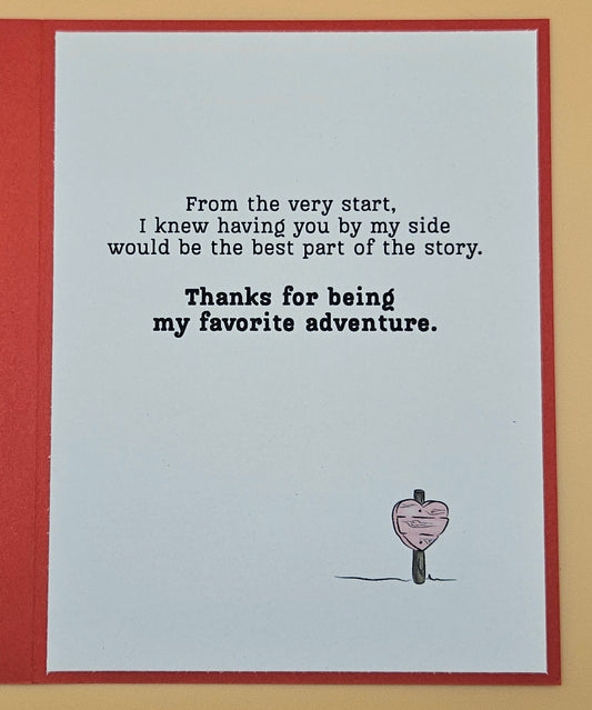 Card with romantic message and heart illustration on a light blue background