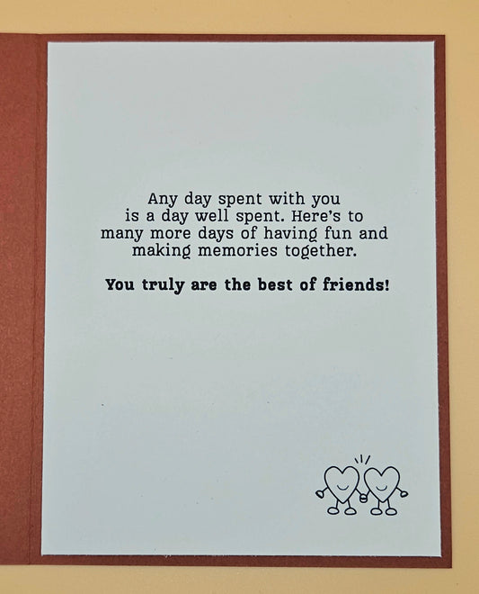 Greeting card with friendship message and hearts illustration on a beige background