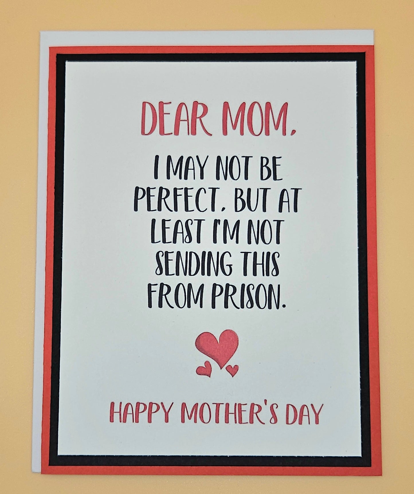 Mother's Day card with humorous message and heart design on a beige background