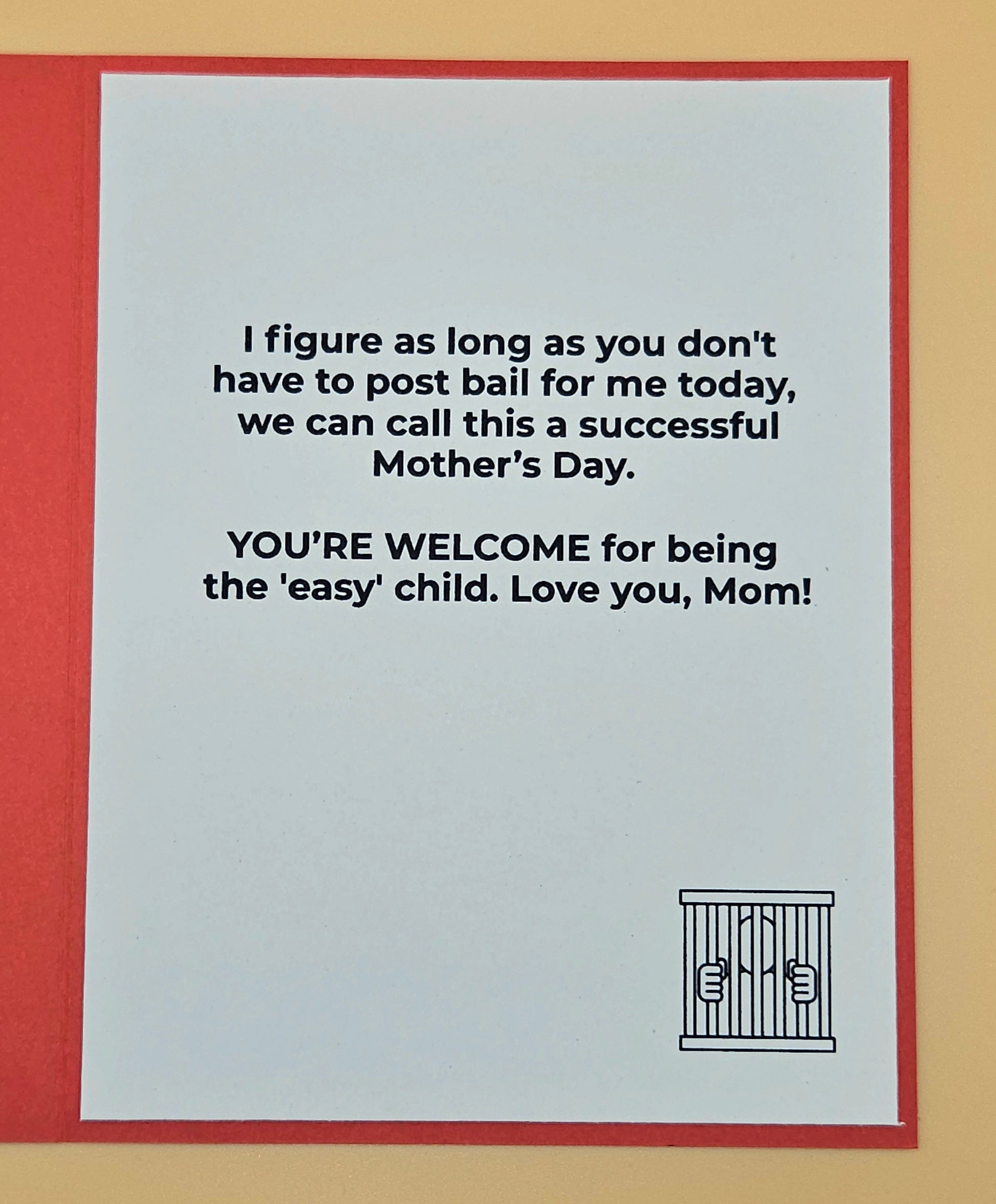 Card with humorous Mother's Day message and jail cell illustration on a red border.