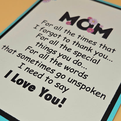 Card with text for mom expressing love and gratitude on a wooden surface