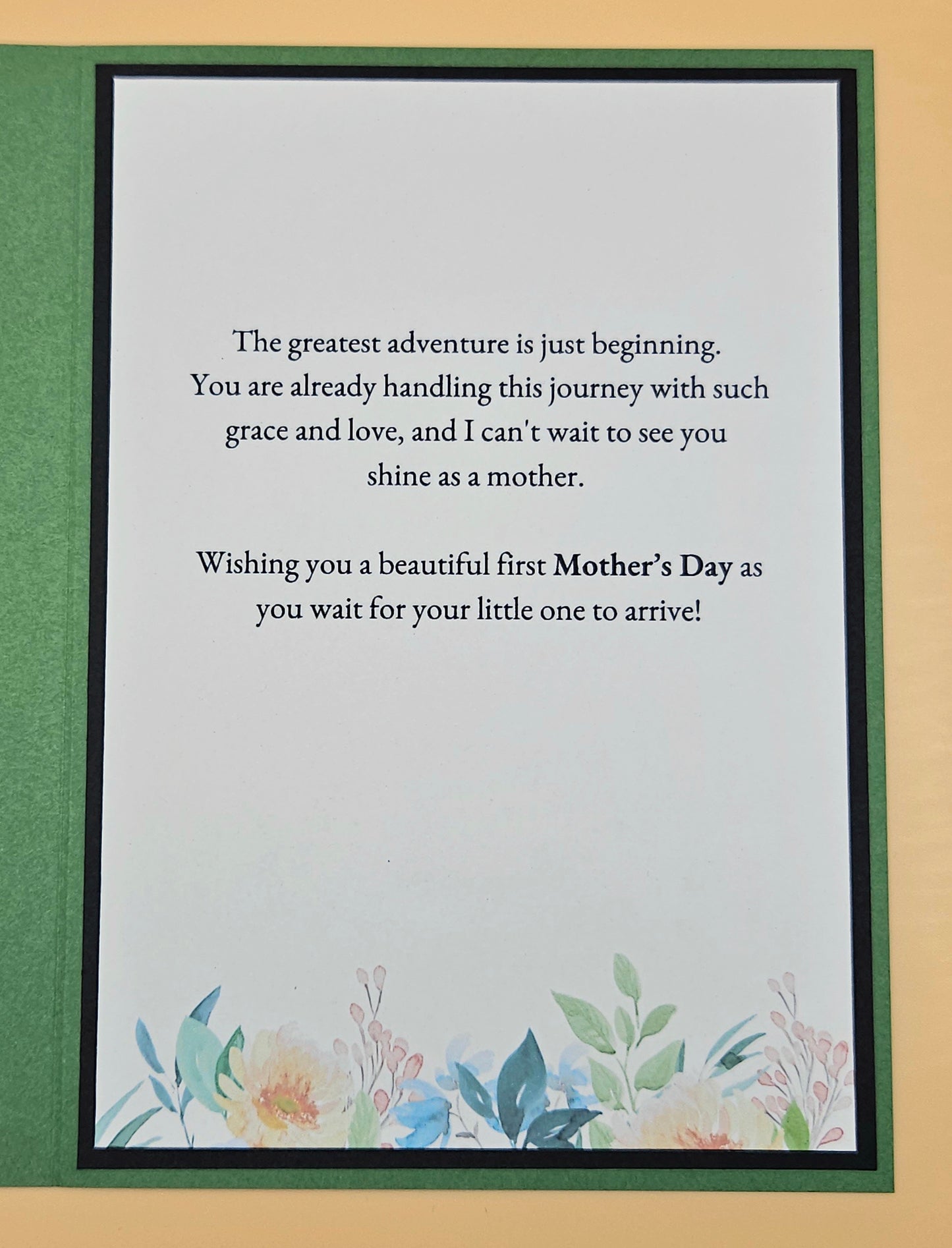 Greeting card with a message for a first-time mother on a floral background