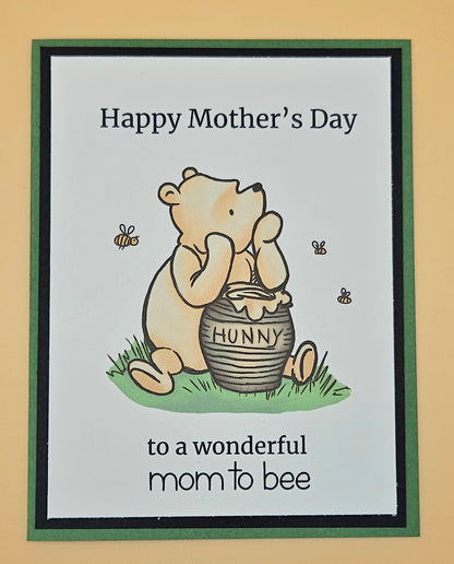 Mother's Day card with a bear holding a honey pot and text on a beige background