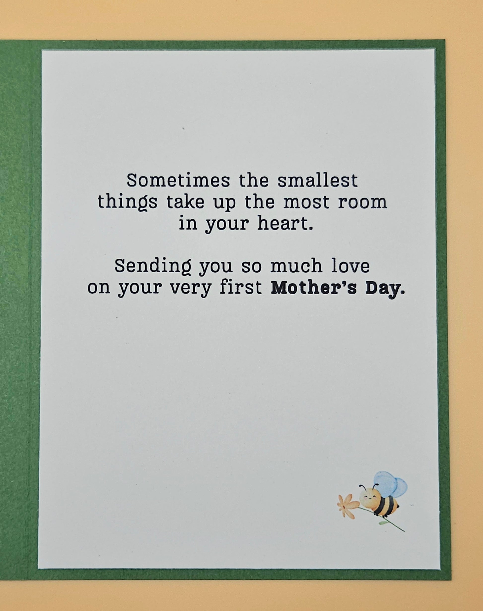 Greeting card with a bee illustration and Mother's Day message on a beige background